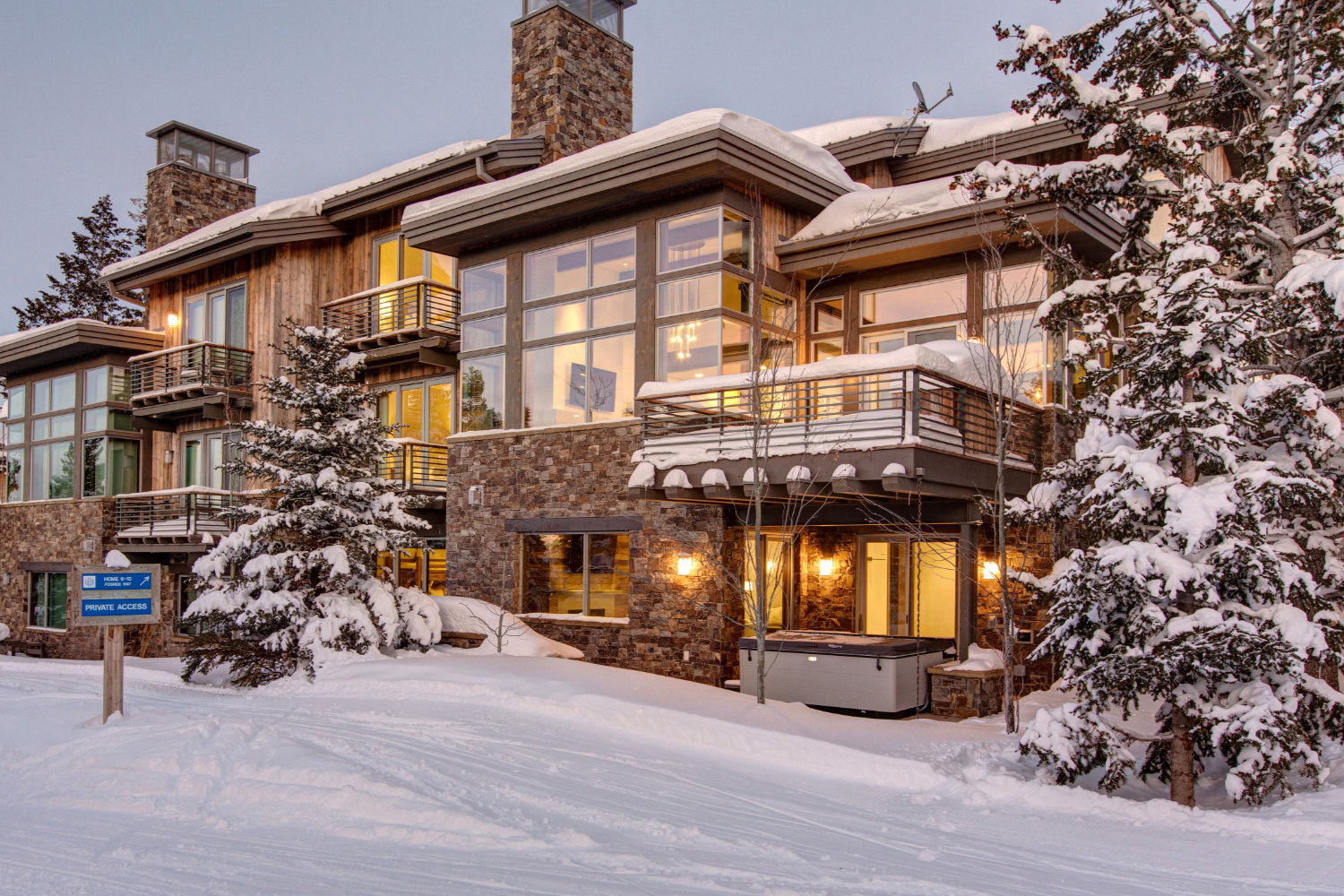 Exterior of Deer Valley ski in ski out house rental with firepit, outdoor grill set on Deer Valley Resort's ski runs